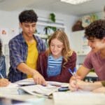 Multiethnic students studying together at secondary school